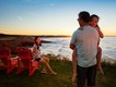3 Family enjoying sunset over the Gulf of St. Lawrence from the red chairs at Oceanview Lookoff near Cavendish Beach, PEI National Park photo Parks Canada Dale Wilson.jpg
