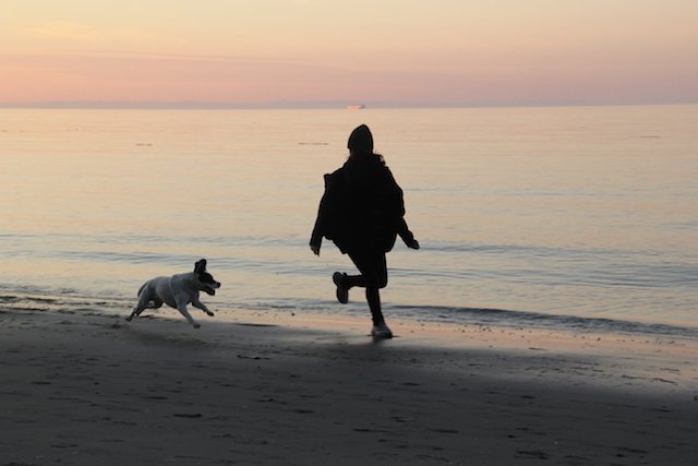 4. Woman & dog on PT beach.jpg