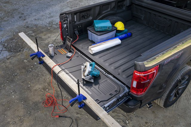A new tailgate makes a great work bench for camp or trailside repairs.JPG