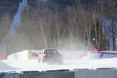 Clouds of snow and exhaust cover the race course photo Perry Mack.JPG